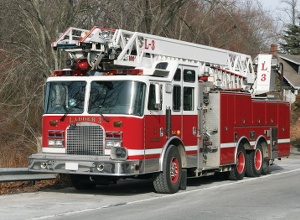 An image of a firetruck that is red and white in color. A firetruck is a common application that would use the Muncie Start to eliminate high-inertia startup.